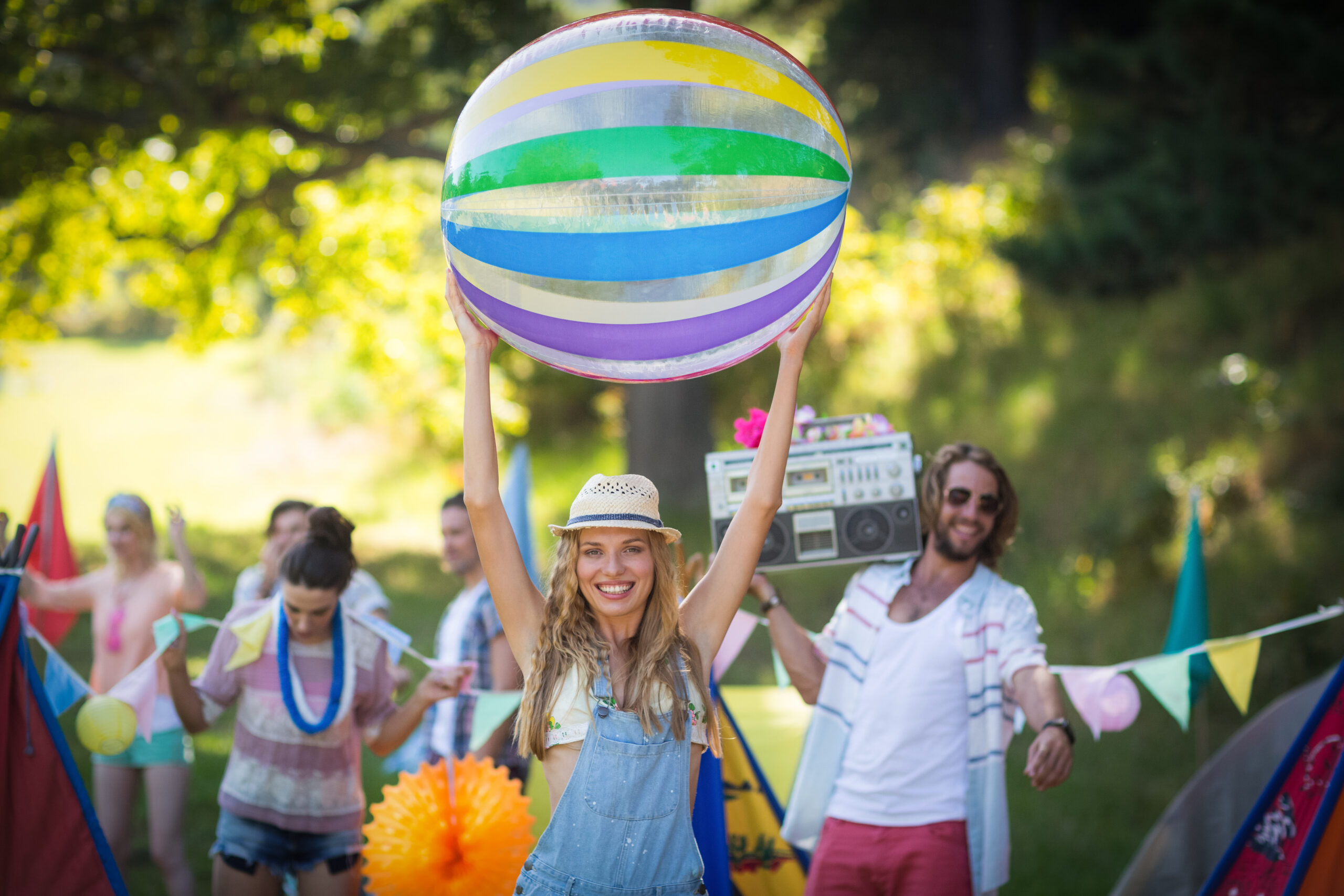 woman-holding-beach-ball-at-campsite-on-a-sunny-da-2026-01-11-10-31-27-utc
